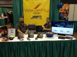 wavefly employees behind a convention booth